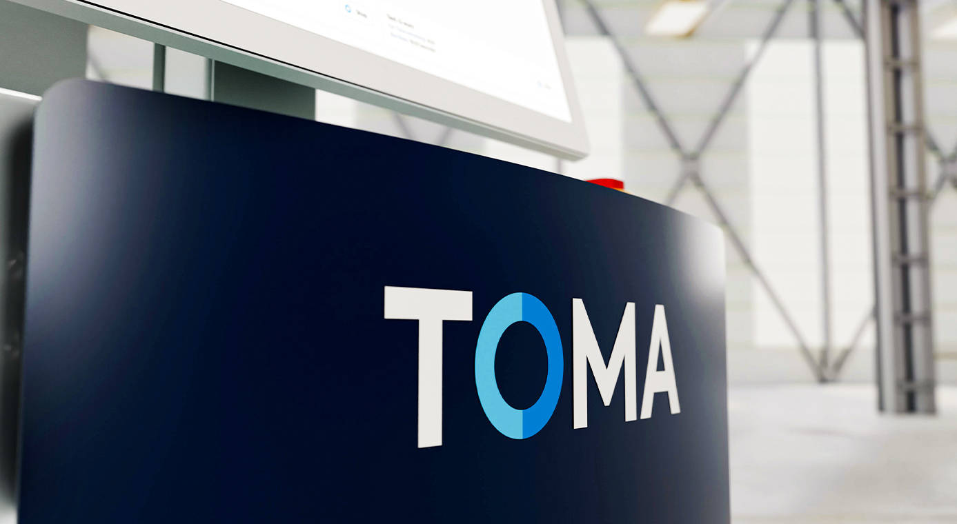 TOMA logo on a collaborative palletizing robot