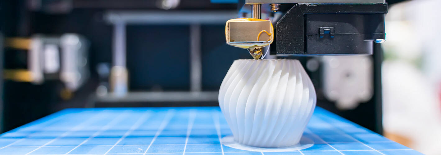 3D printer manufacturing an object